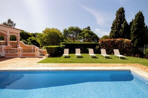 The Swimming Pool - Long chairs, hammocks, green grass and plenty of space.