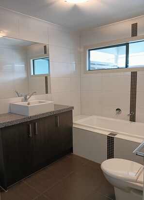 Upstairs bathroom - bathtub, walk in shower and toilet