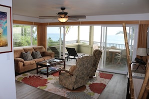 Living room looking to the lanai.  Large corner unit with expansive windows.