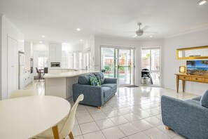 Hang out with the cook! Our family room enjoys both kitchen & Weber BBQ access.