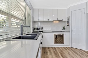 Modern kitchen looking at the river