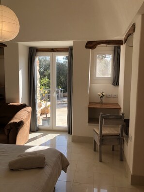 Olive bedroom looking towards the patio and private pool