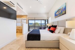 The primary suite is spacious and beautifully styled.